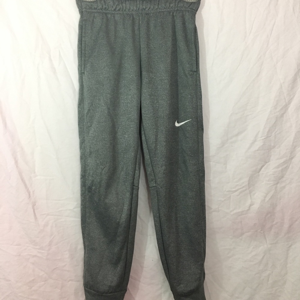 Gray Nike sweatpants with cuffed ankle